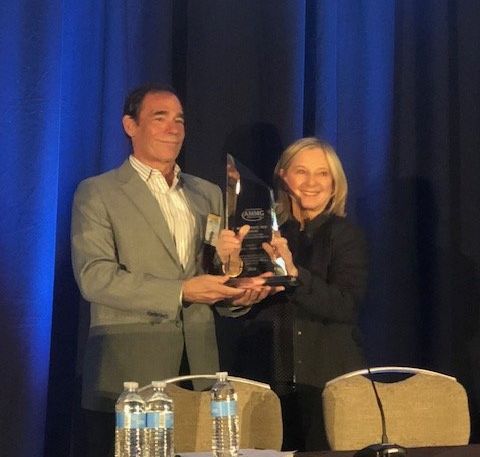 Mark L. Gordon, M.D. receiving the 12th Annual Alan P. Mintz, M.D. Award for Clinical Excellence in Age Management Medicine from Florence Comite